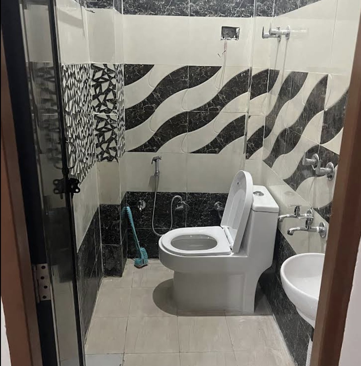 Modern tiled bathroom with shower and washbasin